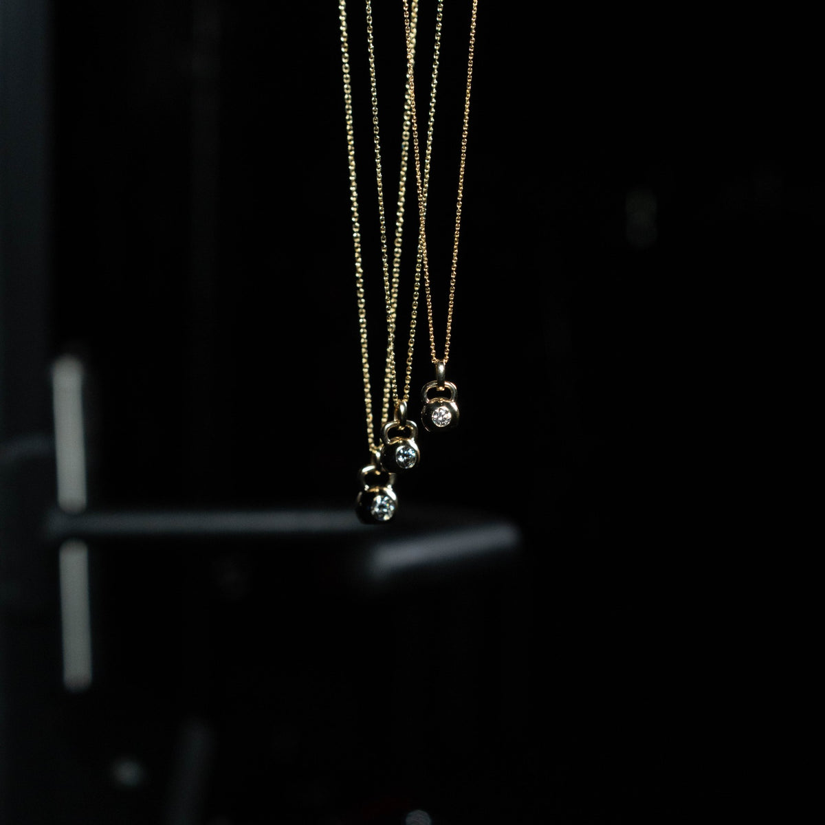 Three Apollo Pendants hanging on 14K gold chains