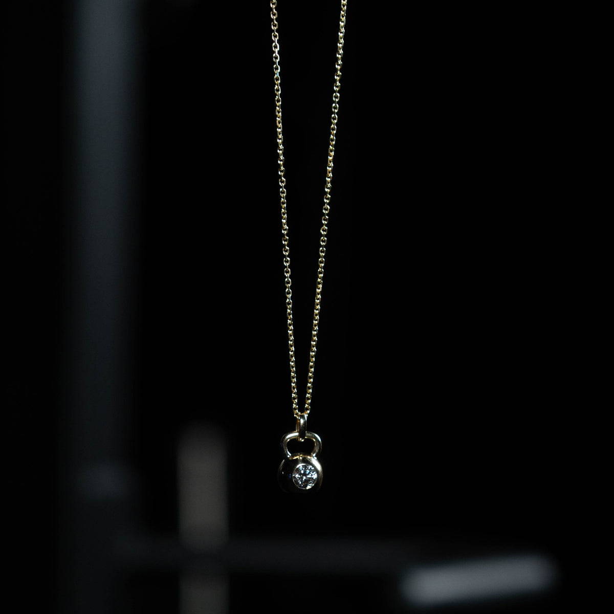 14K gold cable chain hanging with the Apollo Pendant