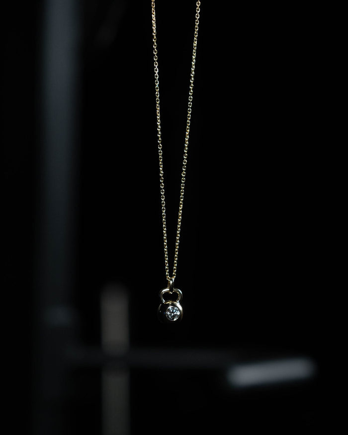 The Signature kettlebell pendant in solid 14k gold