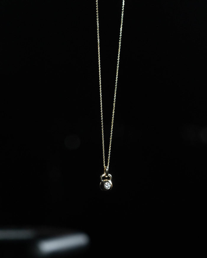 The Signature kettlebell pendant in solid 14k gold