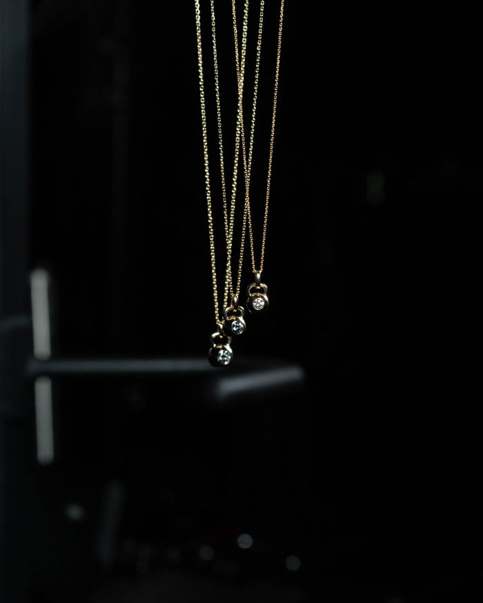 The Signature kettlebell pendant in solid 14k gold